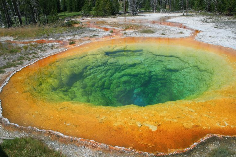 The geyser pool is clear when calm, but impossible to see when bursting forth. 