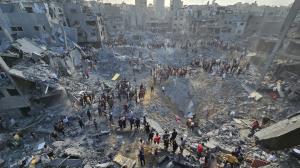 A photograph of the strike aftermath from Oct. 31 shows people gathering around multiple large craters amid destroyed buildings