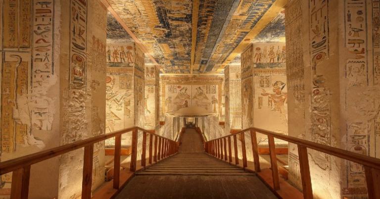 Ancient Egyptian tomb with a large, descending staircase.