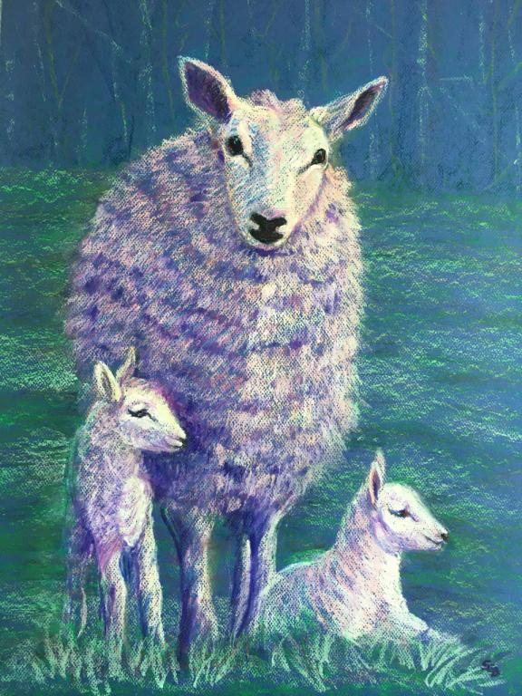 A mother sheep and two lambs.