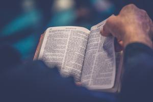 man reading Bible