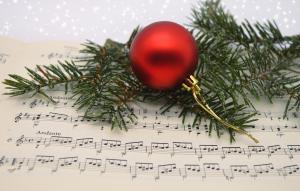 red ornament lying atop sheet music