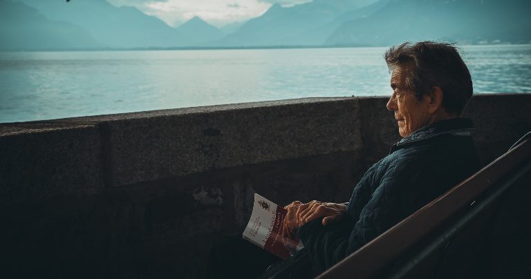 Man looking out across the water