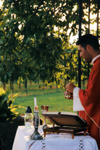 Photo of priest celebrating outdoor Mass.