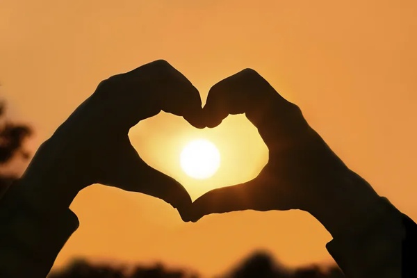 Heart hands frame the sun image by Public Domain on RawPixel