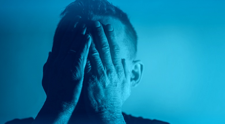 Depression - Sadness - Despair - Man with Hands Covering Face - Blue Depression - Sadness - Despair - Man with Hands Covering Face - Blue Tone