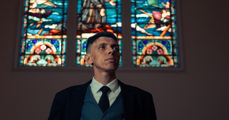 What if the Church? Man standing in front of stained glass