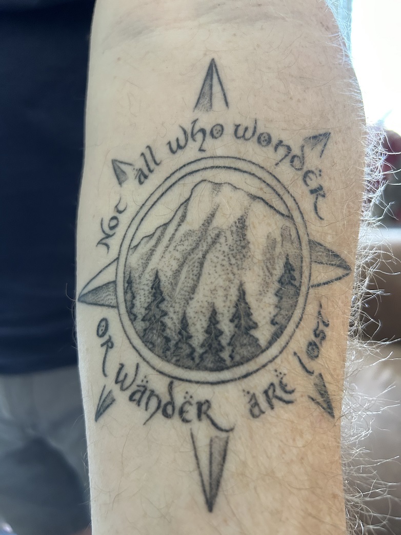 Compass rose with mountain and trees tattoo. "Not all who wonder or wander are lost." Tolkien quote