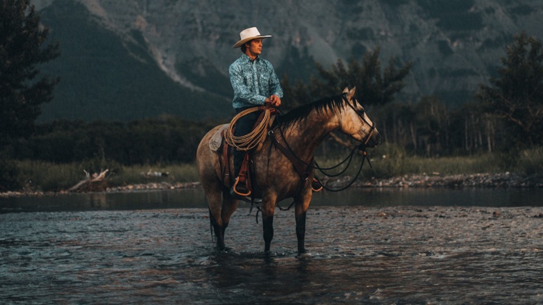 Cowboy on a horse in a river