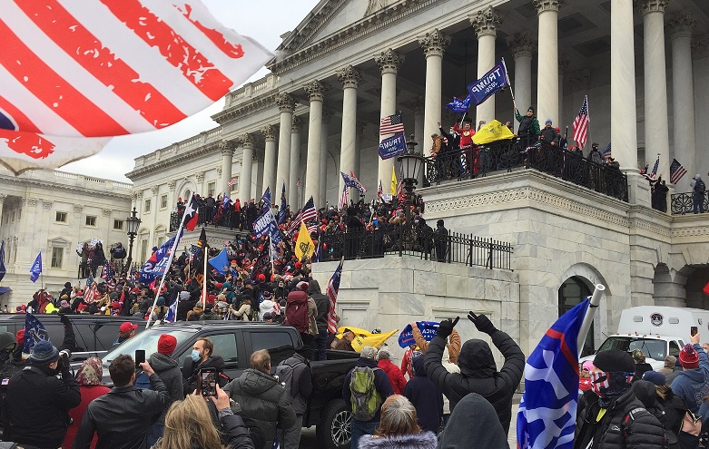 Crowd of Trump supporters marching on the US Capitol on 6 January 2021, ultimately leading the building being breached and several deaths.