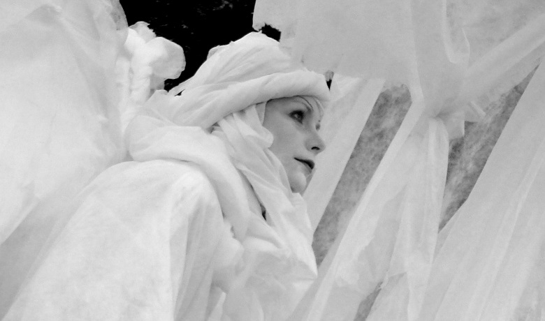 Woman draped in white cloths