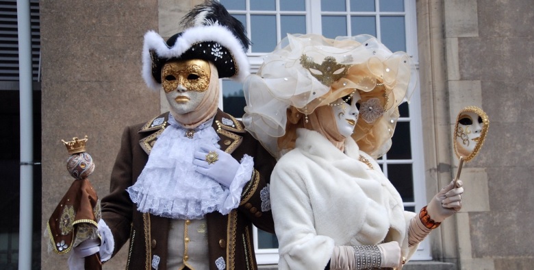 Who do you think you're fooling? Man and woman in masquerade clothing