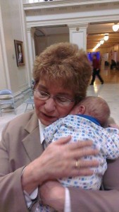 Representative Rebecca Hamilton holds a baby in the Oklahoma Legislature