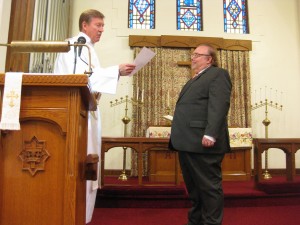 Pastor Rohwer reads his letter to German Honorary Consul Fred Hoffman