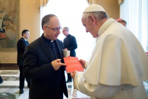 Pope Francis accepts an issue of La Civilta Cattolica from Father Antonio Spadaro, editor of the Jesuit-run magazine, during a Feb. 9 meeting with editors and staff. (CNS photo/L'Osservatore Romano, handout) See POPE-CIVILTA-CATTOLICA Feb. 9, 2017.