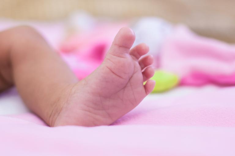 Close up foot of a little african american baby girl - Black peo