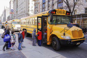 New York City, USA - March 03, 2011: Children entering school bu