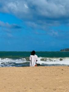Woman in Stillness on the Beach
