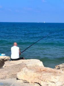 A man fishing in Jaffa , Israel