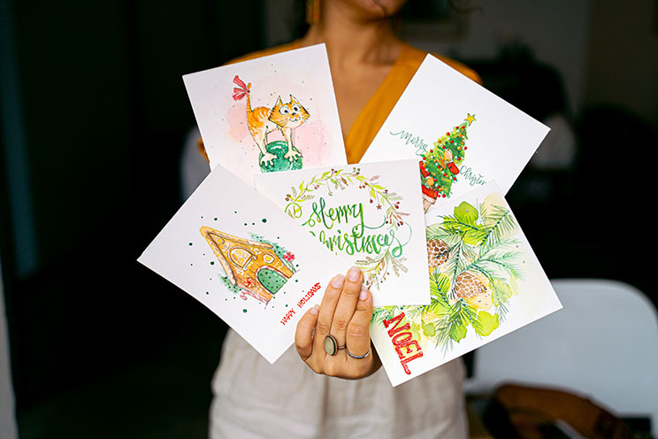 Photo by Anna Tarazevich: https://www.pexels.com/photo/close-up-shot-of-a-person-holding-christmas-cards-6146616/