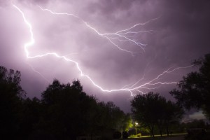 Lightning storm over dark neighborhood