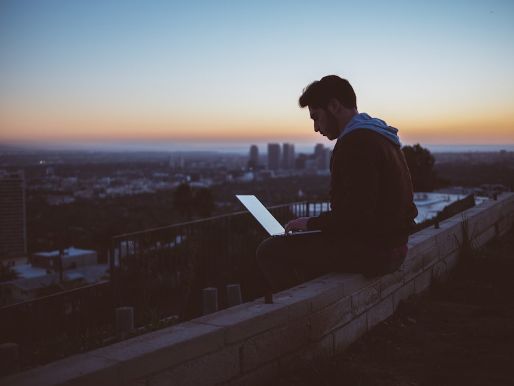 https://unsplash.com/photos/man-sitting-on-concrete-brick-with-opened-laptop-on-his-lap-Z3ownETsdNQ?utm_content=creditShareLink&utm_medium=referral&utm_source=unsplash