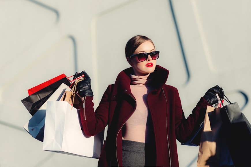 https://unsplash.com/photos/photo-of-woman-holding-white-and-black-paper-bags-_3Q3tsJ01nc?utm_content=creditShareLink&utm_medium=referral&utm_source=unsplash