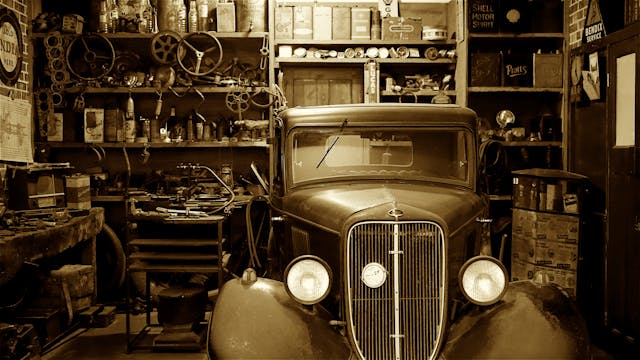 Photo by Mike Bird: https://www.pexels.com/photo/black-vintage-car-on-garage-212100/