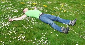 Man relaxing in a meadow.