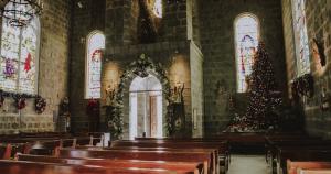 Empty church building decorated for Christmas.