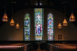 Stained glass windows inside traditional church