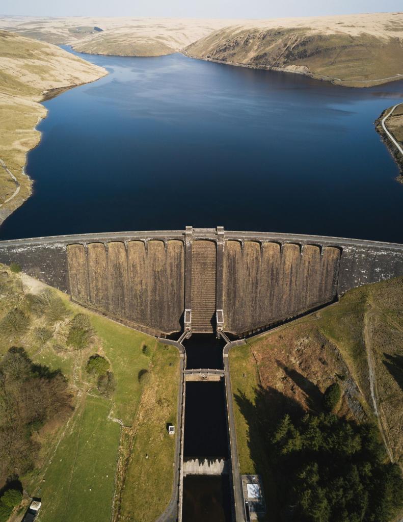 A water reservoir or dam representing the division between the lived and unlived life.