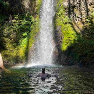 Photo of Dr. Simmons at a waterfall