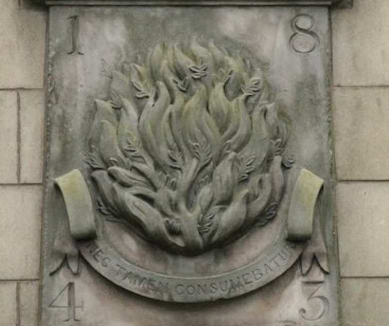 The symbol of the Church of Scotland carved in stone. The burning bush. Nec tamen consumebatur. Nevertheless it was not consumed.