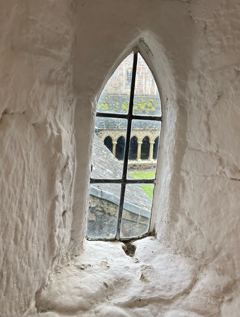Iona Abbey cloisters as seen through a white washed window