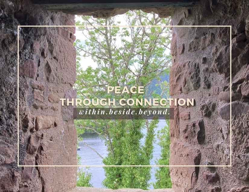looking through a stone window to Loch Ness with a tree in the background. Peace through Connection. Within. Beside. Beyond.