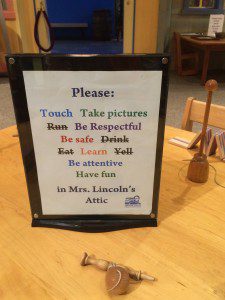 Sign at the Lincoln Museum encouraging kids to play with 19th century toys