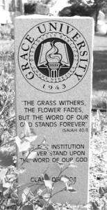 Dedication stone in the courtyard of Grace University (NE)