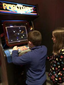 Isaiah playing the 1982 arcade game Robotron