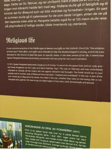 a picture of a museum informational sign in English and Norwegian.