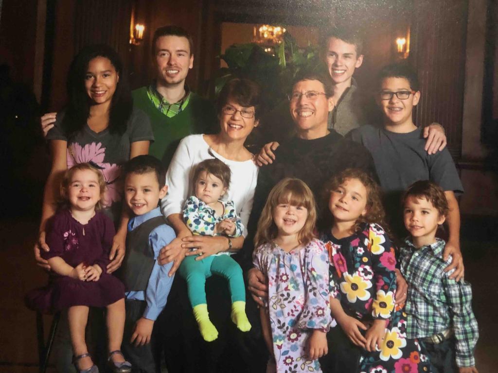 Photo of grandparents with ten grandchildren