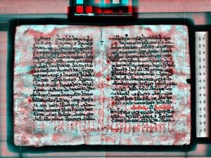 a scan of a text with layers of writing, shown in different colors