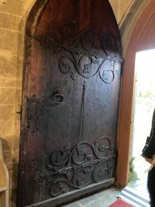a large wooden door with letters and runes carved into it