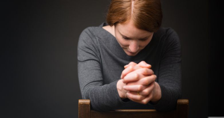 Woman in fervent prayer