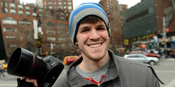Brandon Stanton, creator of the Humans of New York blog, with his camera February 22, 2013 across the street from Union Square in New York. Some like New York's skyscrapers, bridges, his energy, taxis or lights. But Brandon Stanton has set himself another challenge: photograph of 10,000 inhabitants for a blog now famous "Humans of New York." In two years, he has photographed 5,000 New Yorkers, children leaving school, tramps, fashionistas, New York with a bouquet of tulips, old lady with a cane, municipal employees, etc. And nearly 560,000 fans now follow his Facebook page.AFP PHOTO/Stan HONDA (Photo credit should read STAN HONDA/AFP/Getty Images)