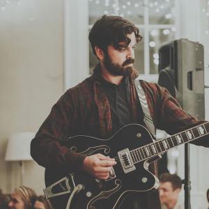 Jervis Campbell playing guitar