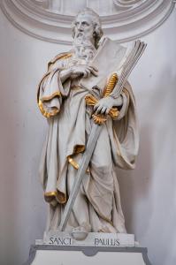 Saint Paul holding texts of the Bible, the "sword of the Spirit," gold embossed statute.