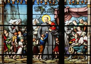 A stained glass window depicting a Nativity Scene