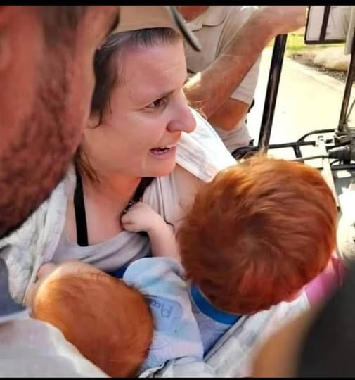 mother clutching children