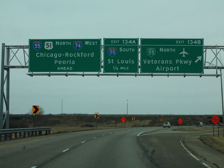 Road signs on Interstate 74 in Bloomington, IL at Veteran's Parkway Exit